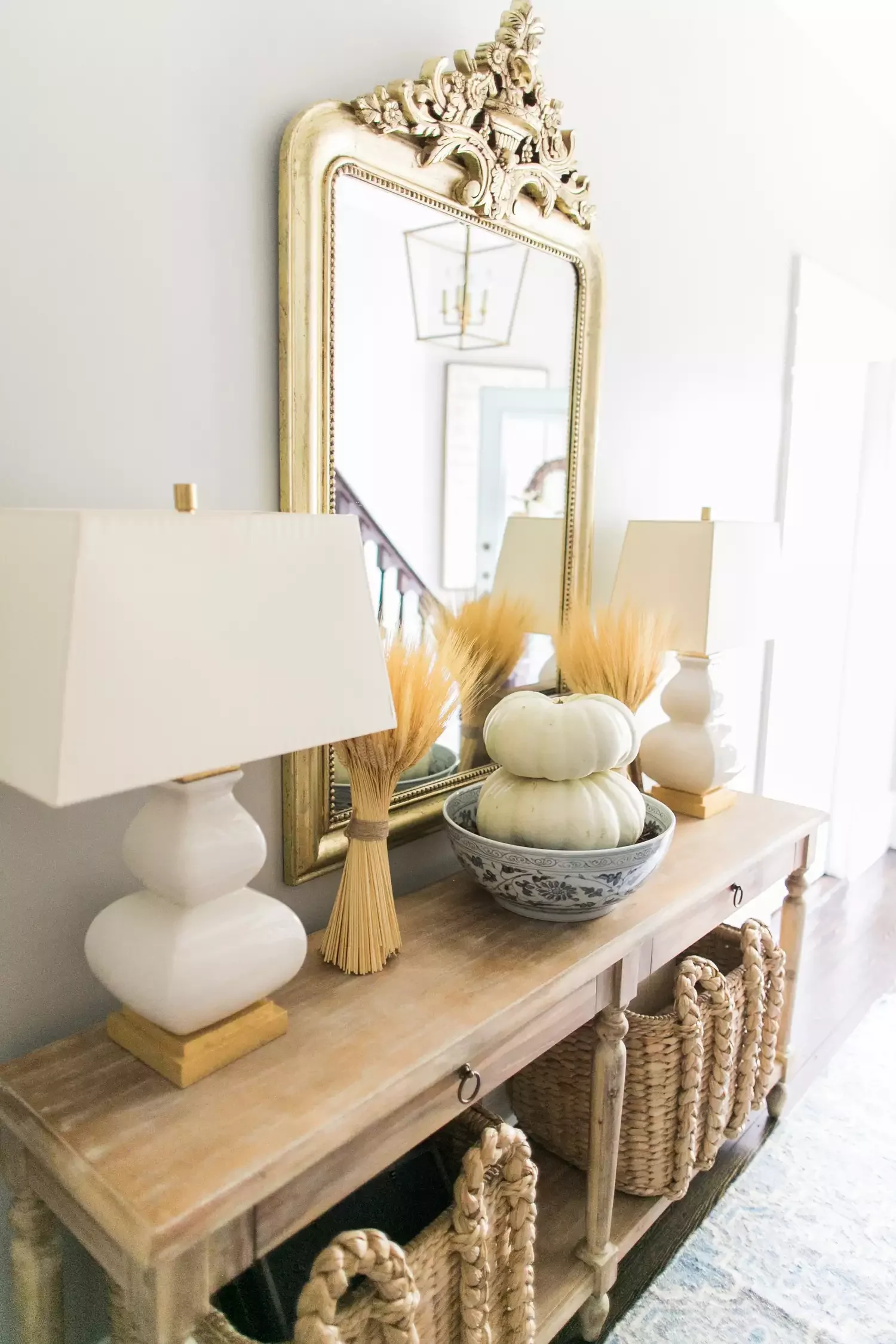 33 Stunning Fall Entryway Ideas That Transform Your Home for Autumn 27 Mix Pumpkins and Wheat