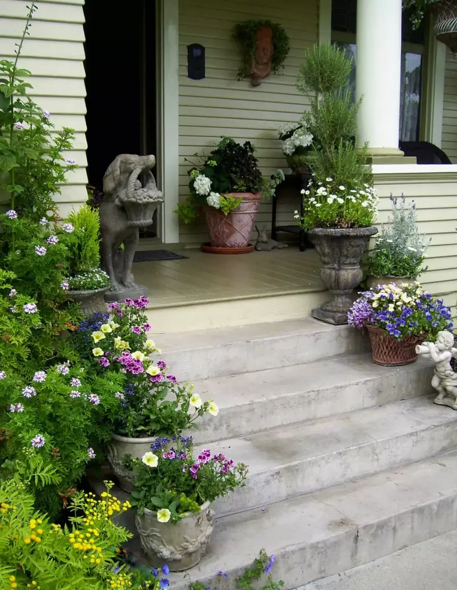 62 Warm and Inviting Front Porch Design Ideas That Welcome Everyone Home 29 Mix in Garden Sculptures