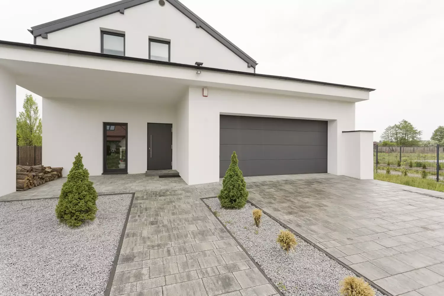 Modern, Rock-Lined Driveway Entrance