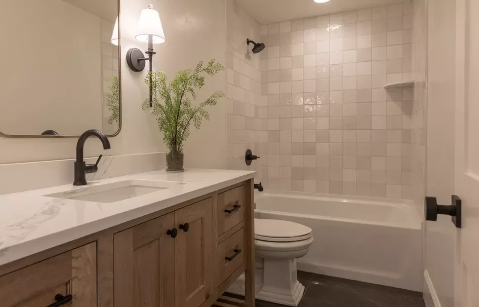 30 Stunning Corner Shower Designs to Elevate Your Bathroom 9 Monochrome Tiled Corner Shower