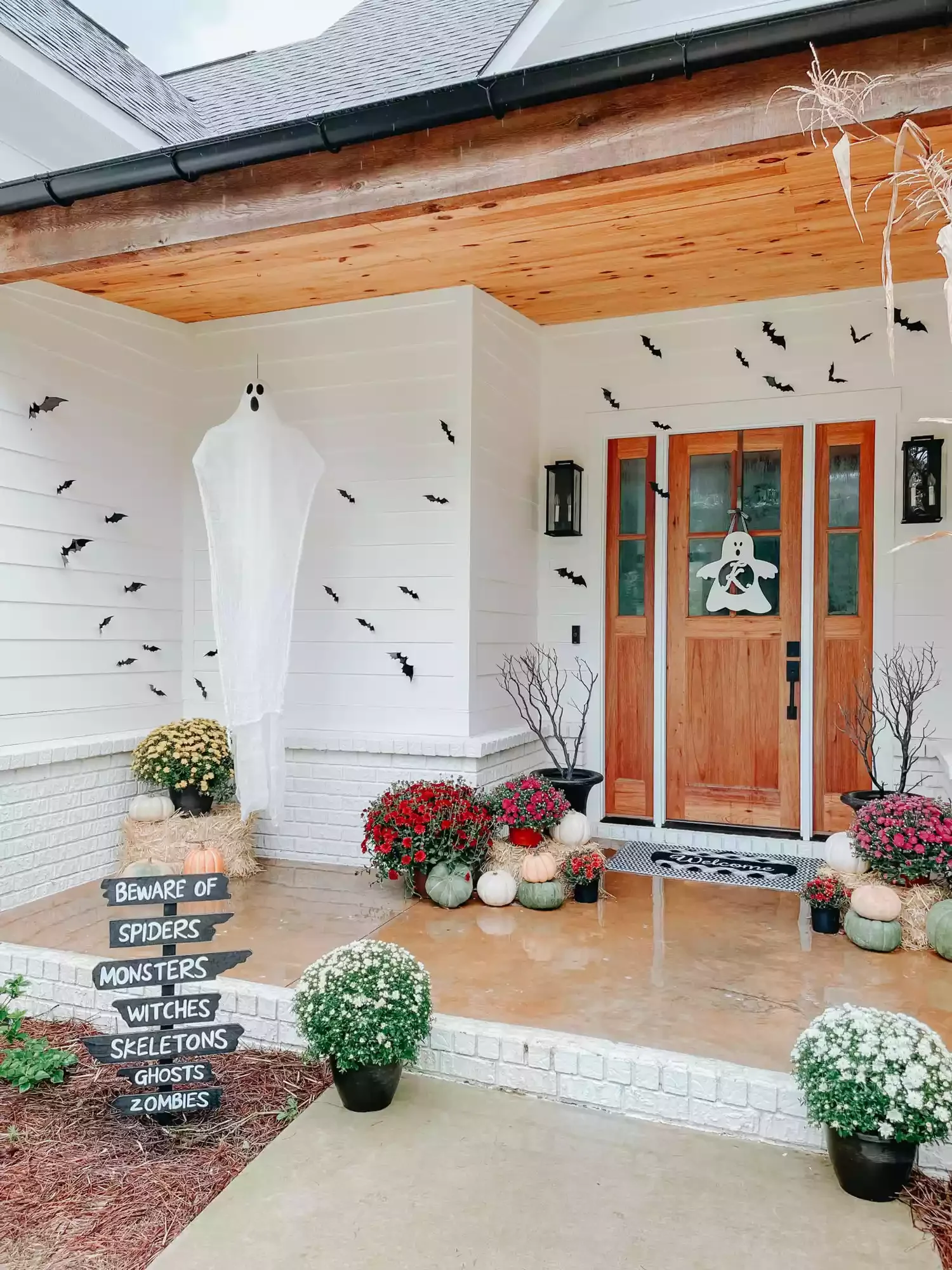 42 Quick Halloween Door Decorations You Can Create in Under an Hour 36 Monogrammed Ghost Door Hanger