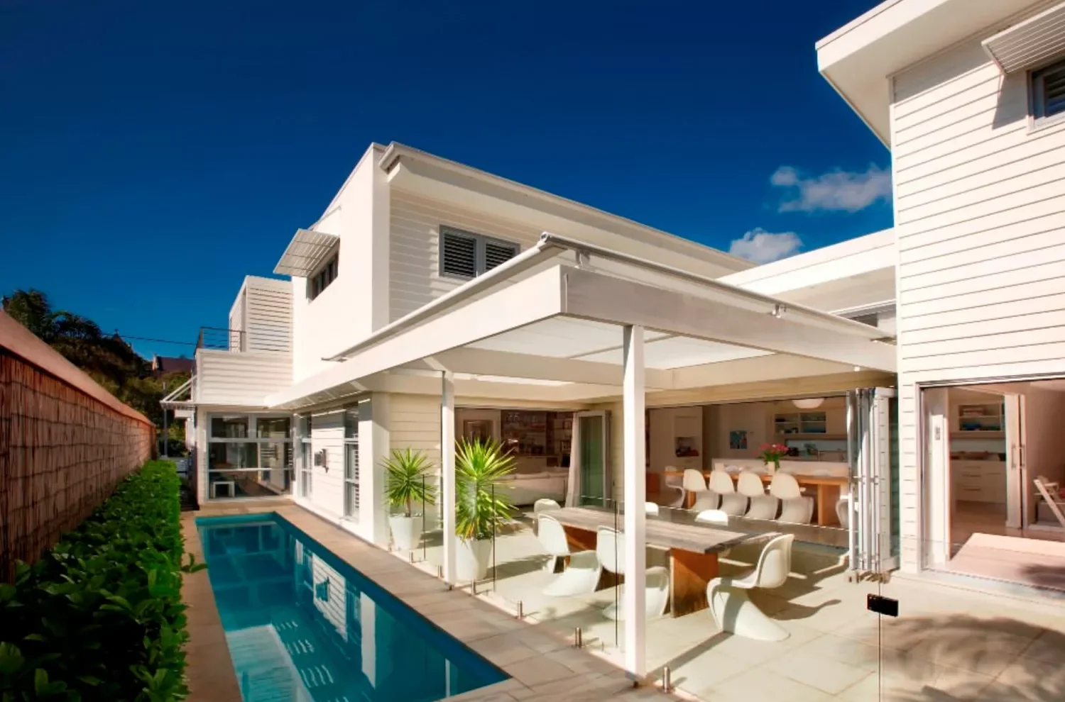 50 Stunning Patio Cover Ideas to Transform Your Outdoor Space Opt for a Glass Awning