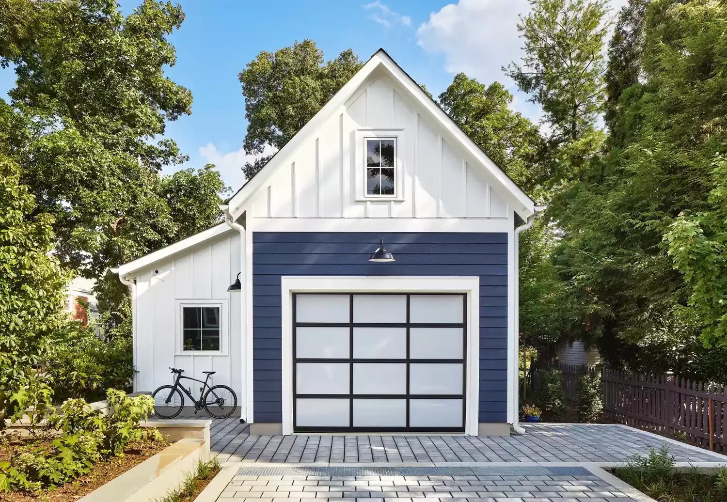 23 Stunning Detached Garage Ideas That Will Transform Your Home's Curb Appeal Opt for a Modern Garage Door