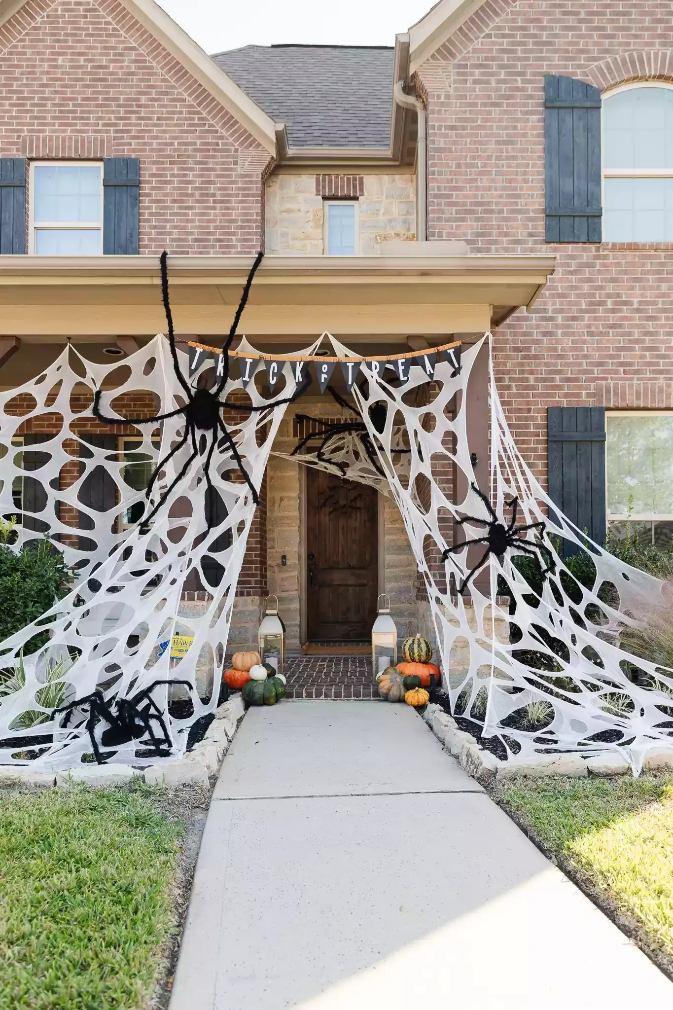 42 Quick Halloween Door Decorations You Can Create in Under an Hour 42 Oversized Cobweb Decor