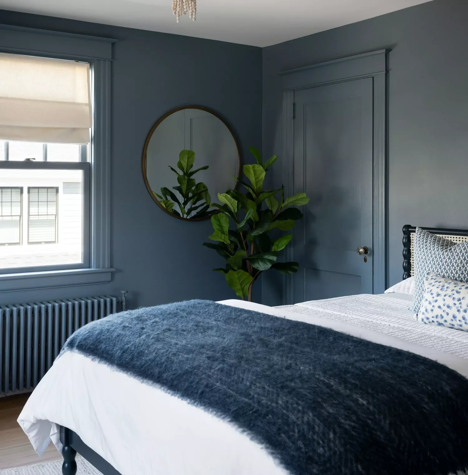 25 Stunning Navy Blue Bedroom Ideas That Will Transform Your Space 12 Paint Your Door and Trim to Match