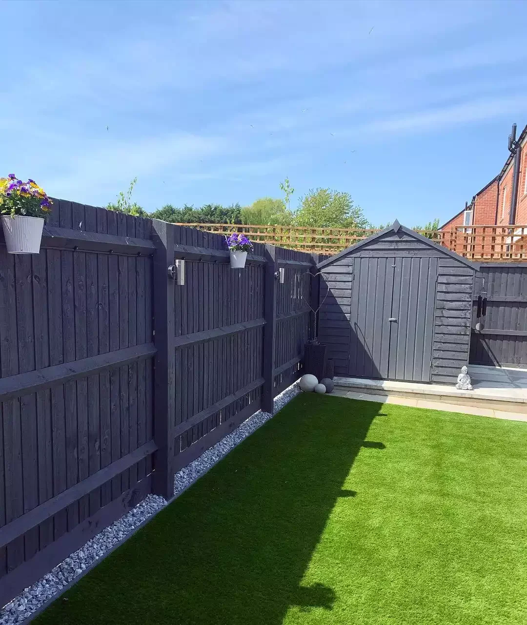 37 Budget Backyard Ideas That Create a Stunning Retreat Paint Your Fence Black