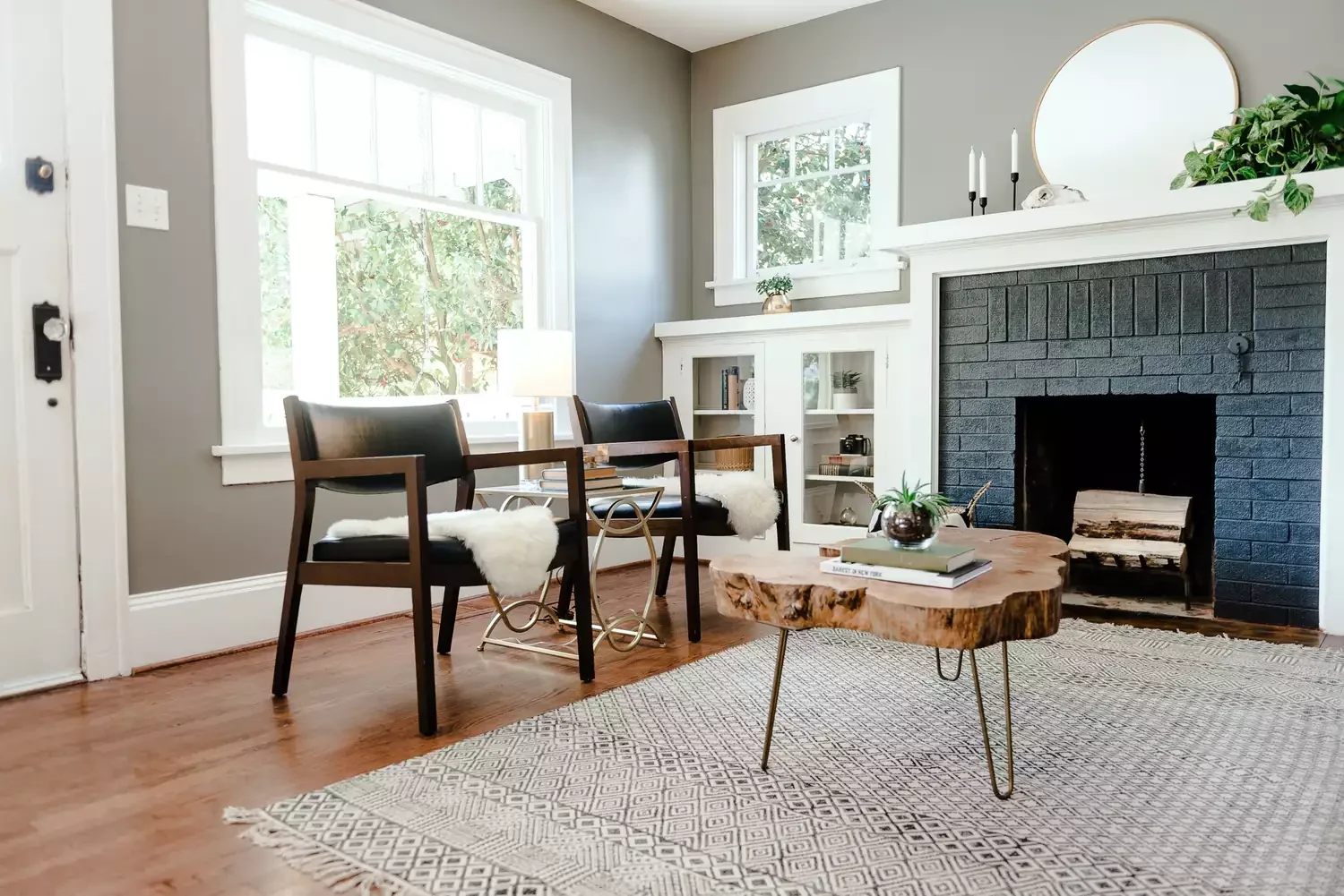 35 Bold Black Fireplace Designs That Transform Any Room Into a Stunning Showcase 26 Painted Brick Surround