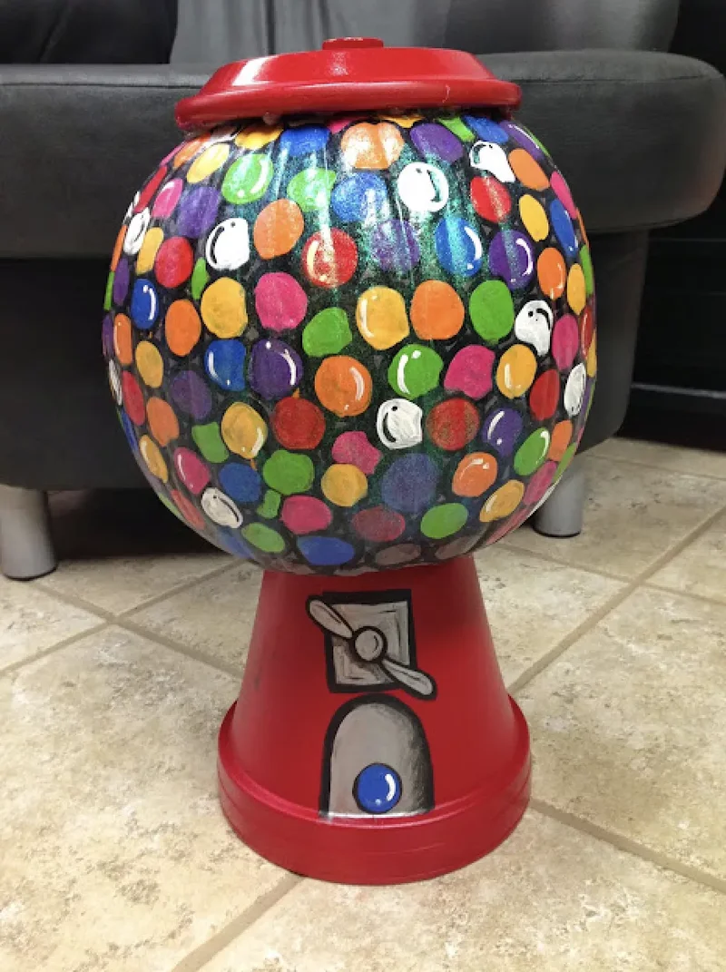 90 Creative Halloween Pumpkin Decorating Ideas to Try This Season 54 Painted Gumball Machine Pumpkin