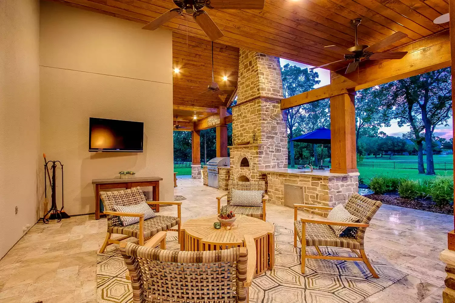 16 Creative Patio Extension Ideas to Maximize Your Outdoor Living Space 14 Patio Extension With Stone Fireplace and Roof