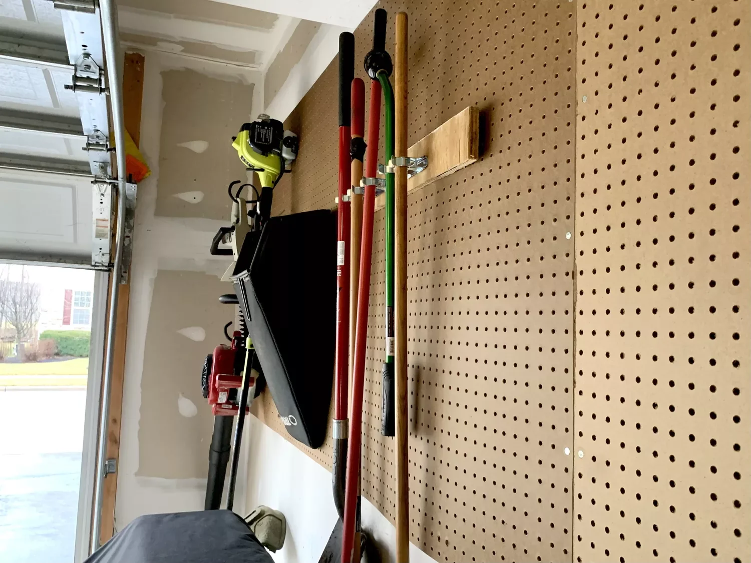 14 Smart Lawn Mower Storage Solutions That Transform Your Home Pegboard