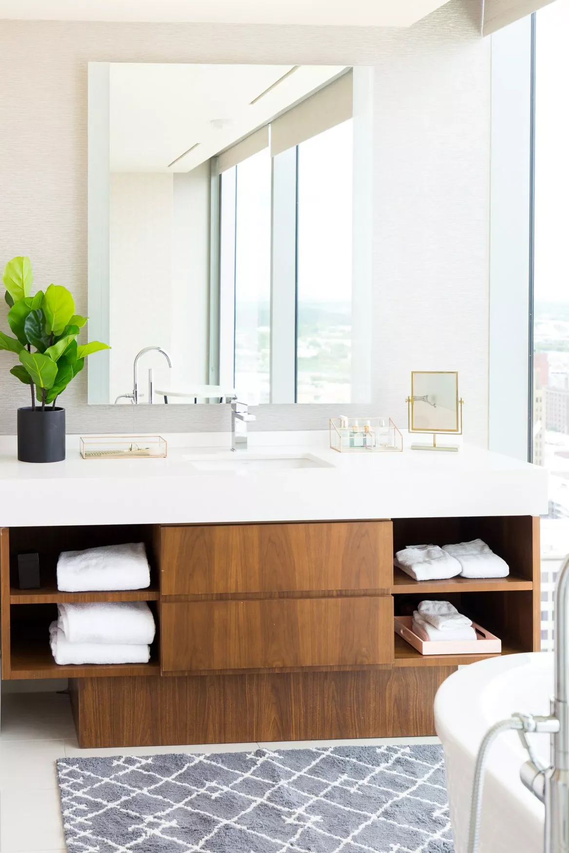43 Smart Bathroom Storage Solutions That Maximize Every Inch Pick a Vanity With Open Shelving