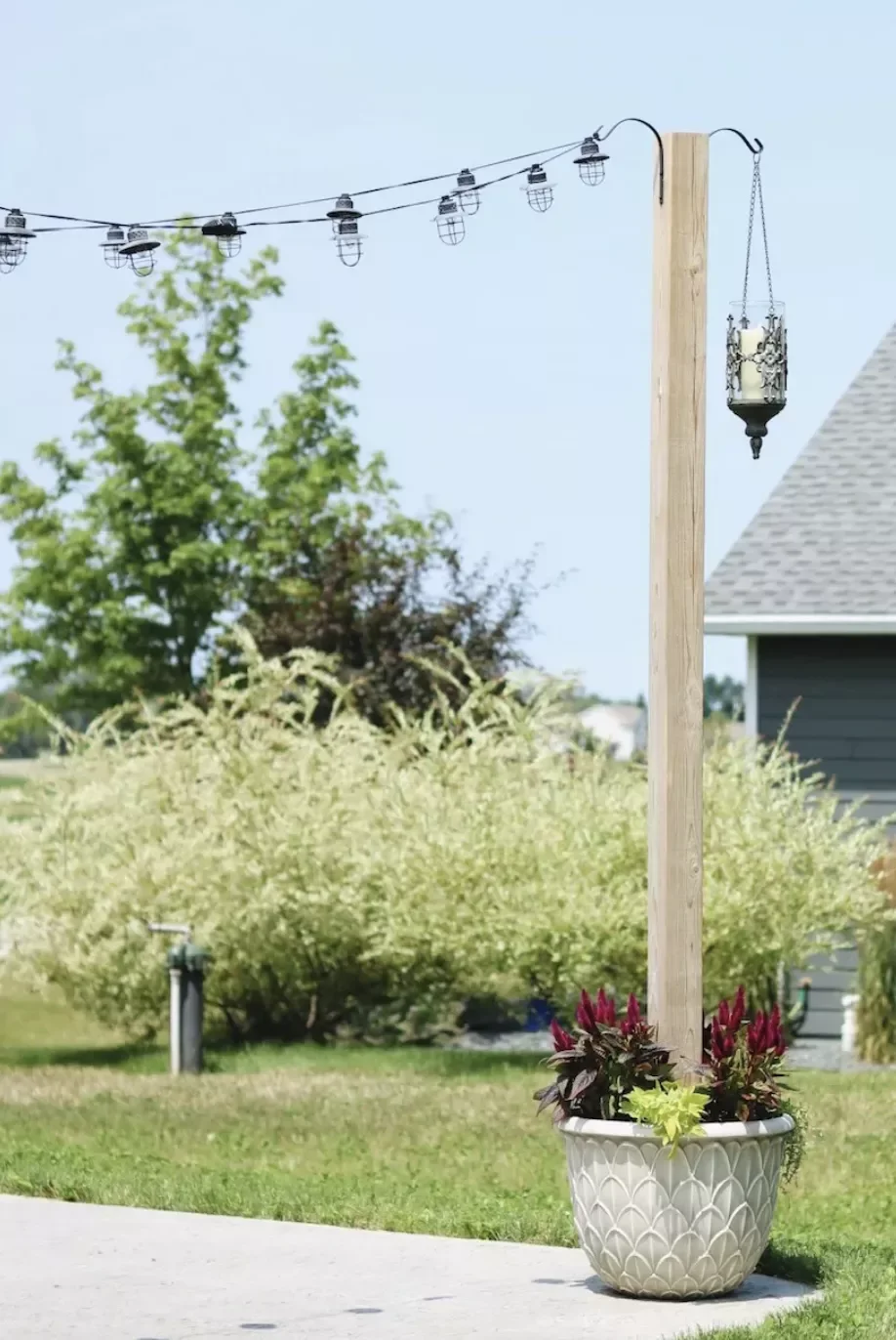 40 Budget-Friendly DIY Backyard Projects to Create Your Dream Outdoor Space Place Wooden Posts Inside Planters