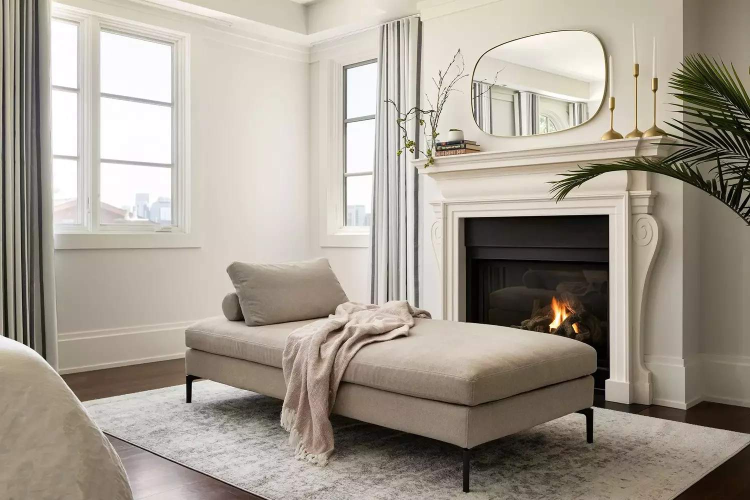 22 Cozy Bedroom Seating Ideas That Will Transform Your Sleep Space 9 Place a Chaise by the Fireplace