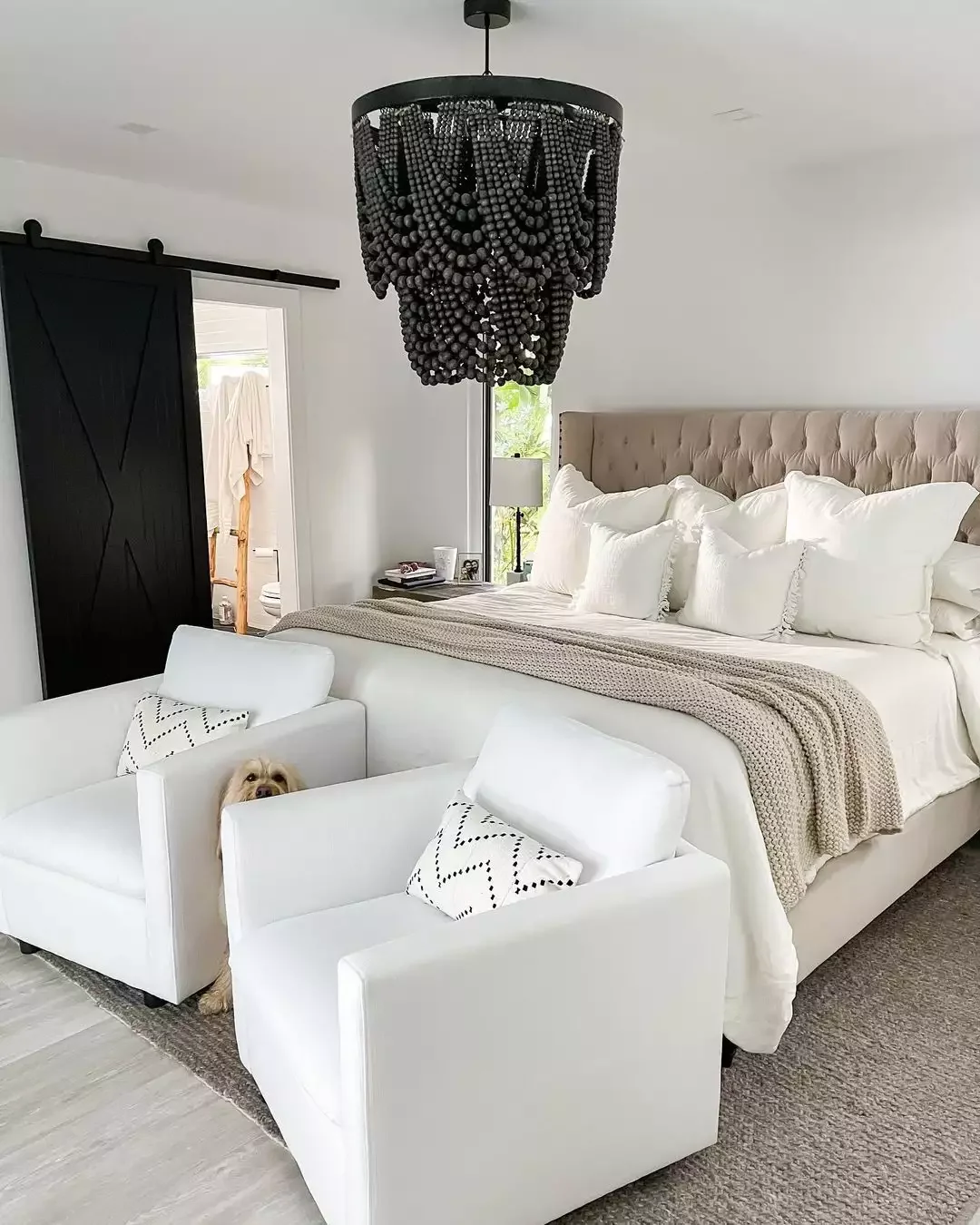 40 White Bedroom Ideas That Will Transform Your Space Into a Stunning Retreat 7 Plush Seating in a Primary Bedroom