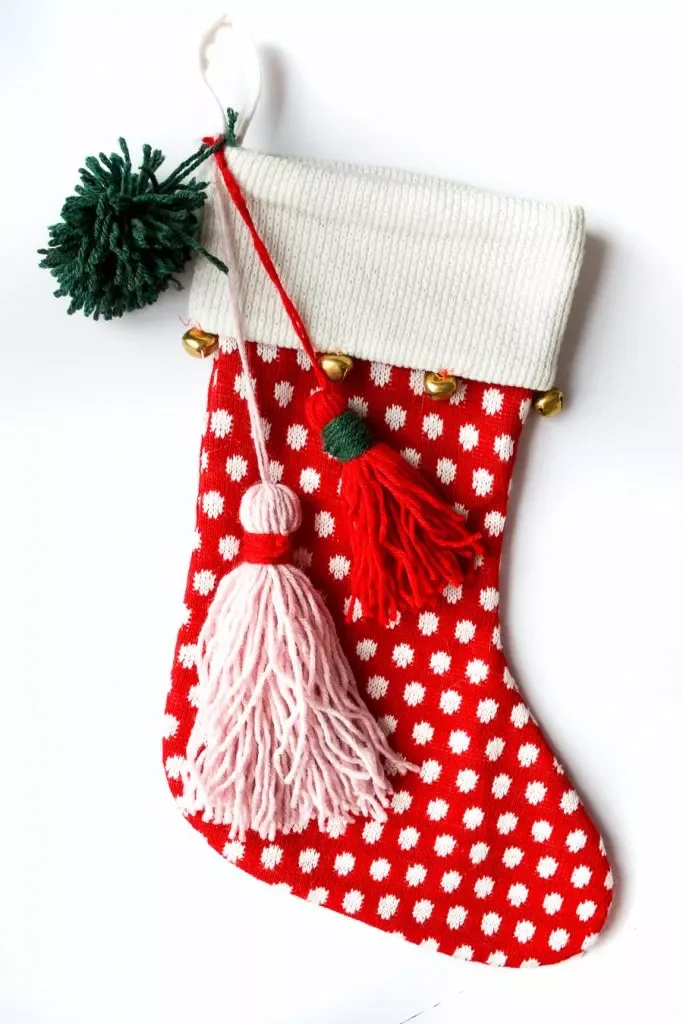 41 Creative DIY Christmas Stocking Ideas That Will Transform Your Holiday Decor 8 Pom Pom and Tassel Stockings