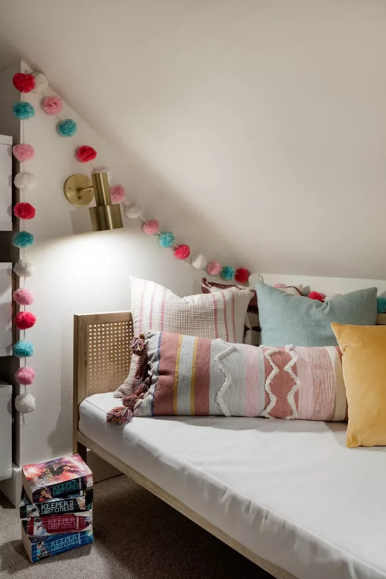 25 Enchanting Kids' Reading Nooks That Blend Style and Functionality 4 Pompom Garland