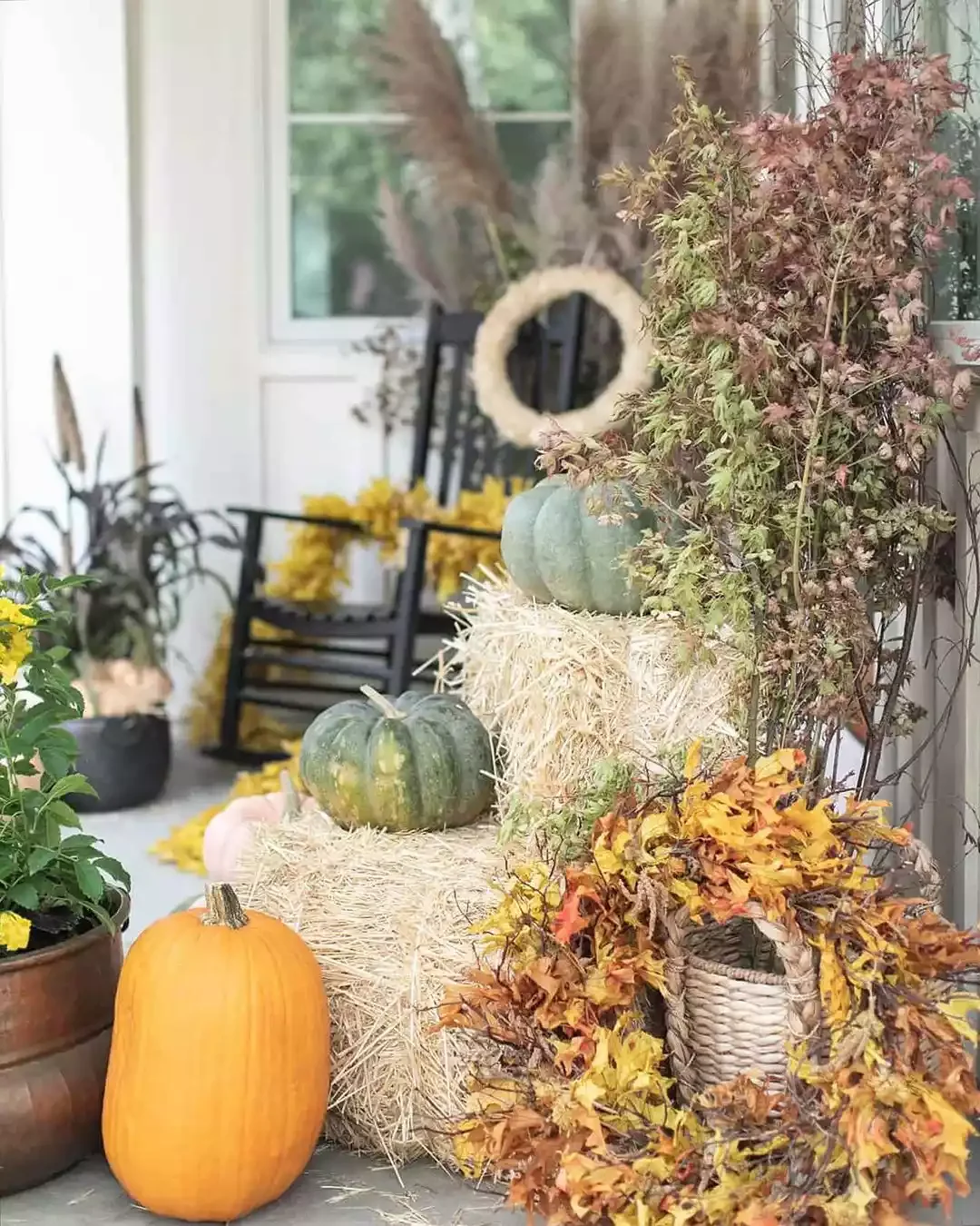 52 Autumn Front Porch Ideas That Will Transform Your Home's Entrance This Fall 31 Prop Up Fall Wreaths