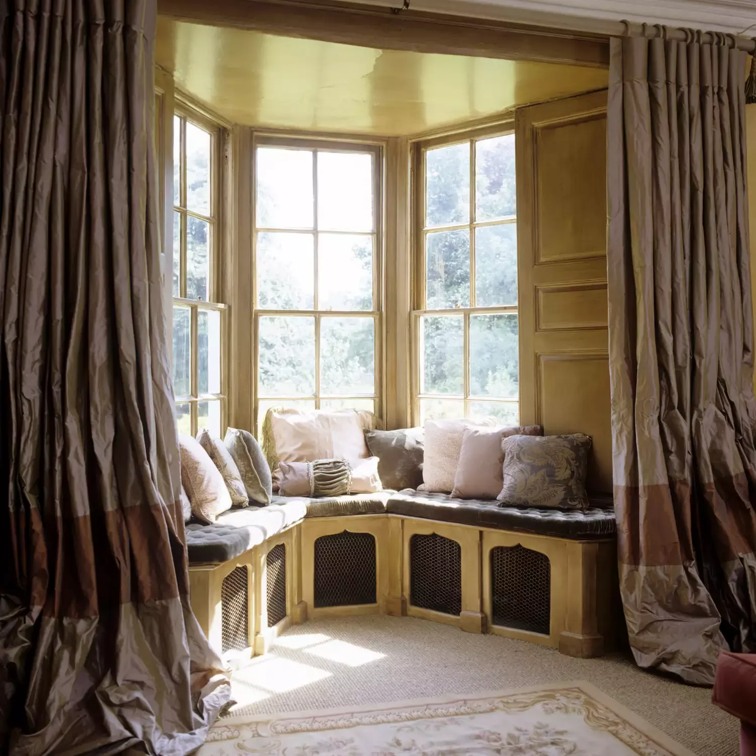 22 Creative Bay Window Dressing Ideas That Will Transform Your Space 14 Puddled Curtains