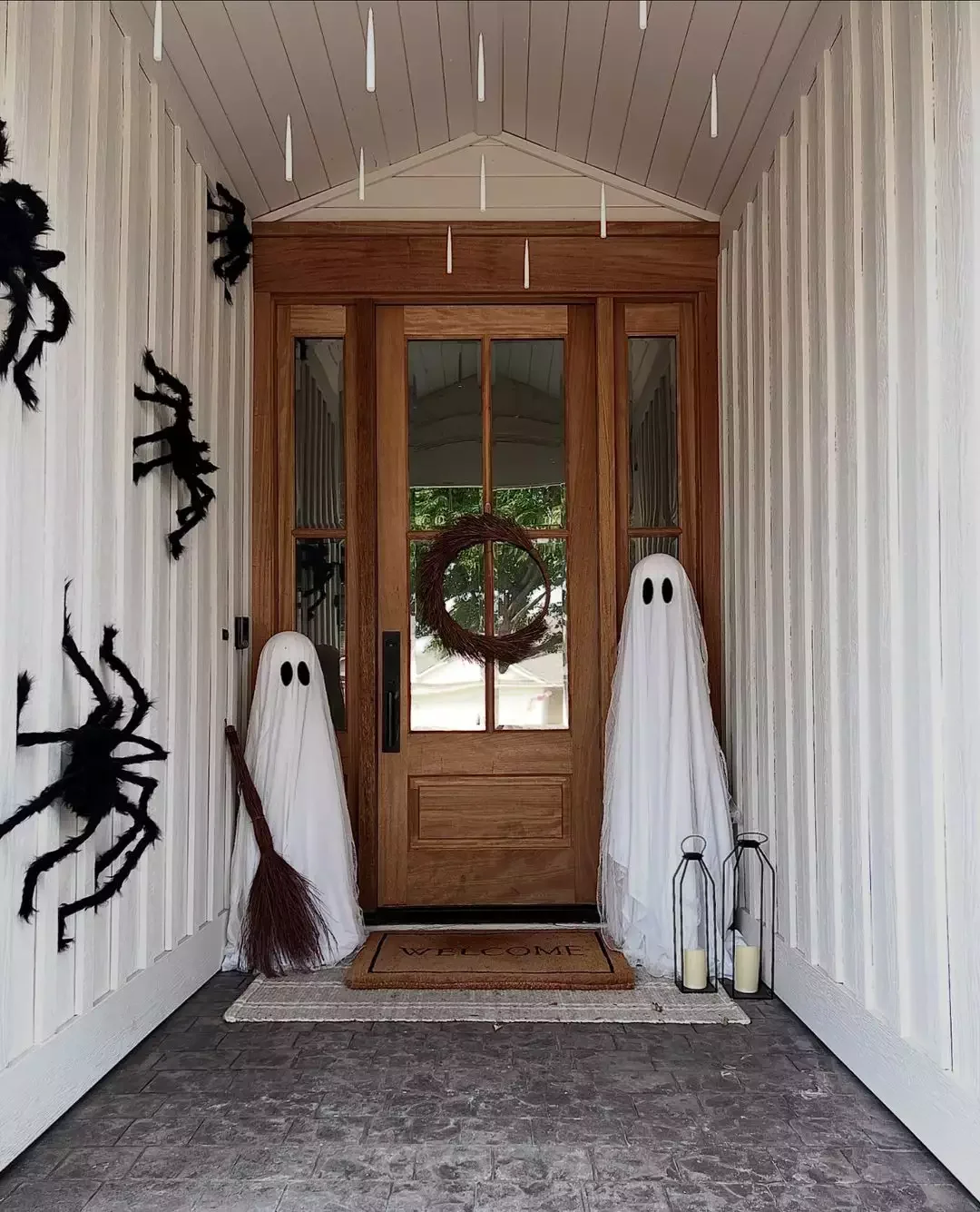 33 Spooktacular Halloween Front Porch Ideas That'll Make Your Home the Neighborhood's Must-See Destination 10 Put Up Some Floating Candles
