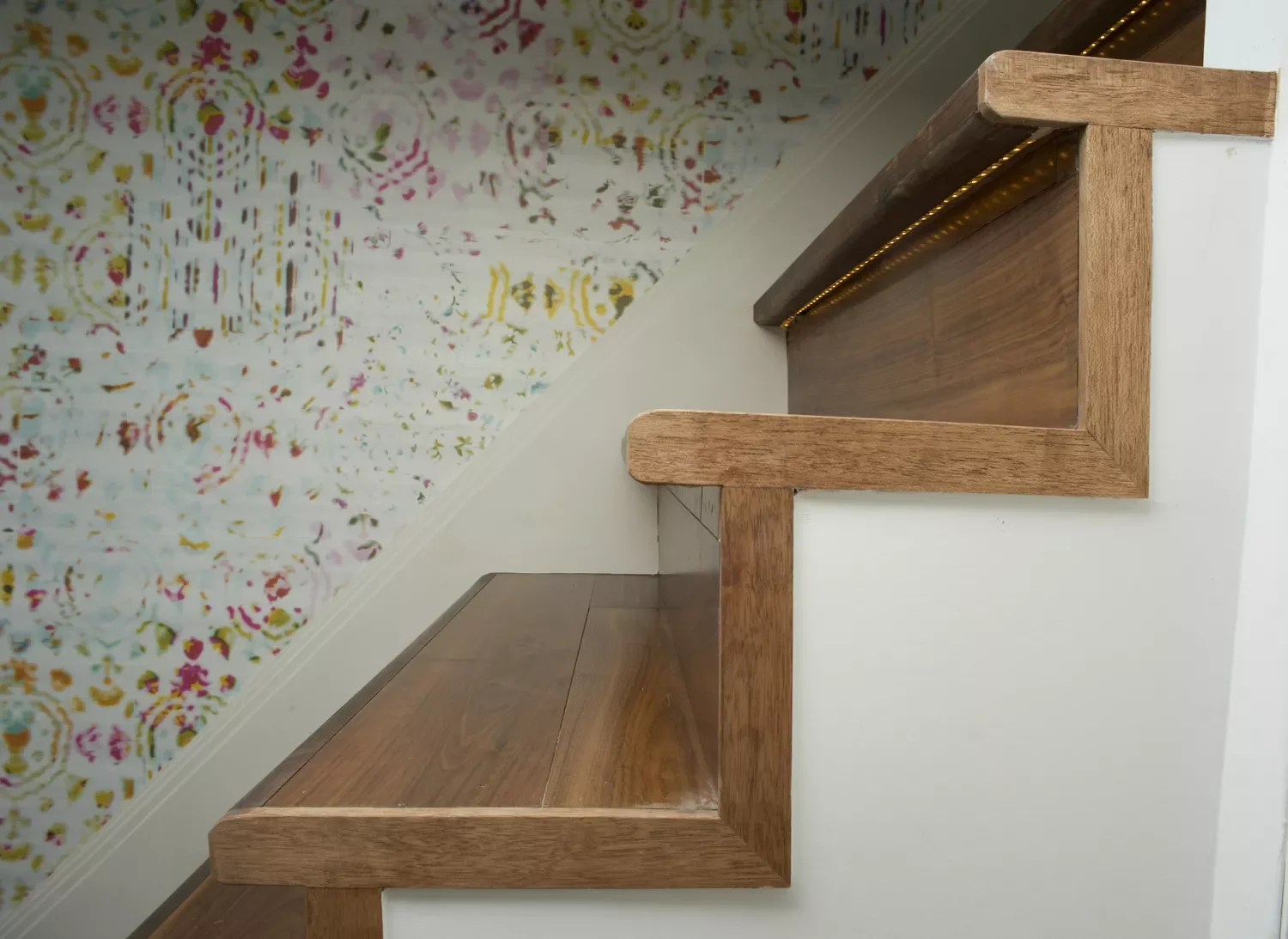 15 Creative Basement Stairway Ideas to Completely Transform Your Lower Level 6 Put Up Vinyl Wallpaper