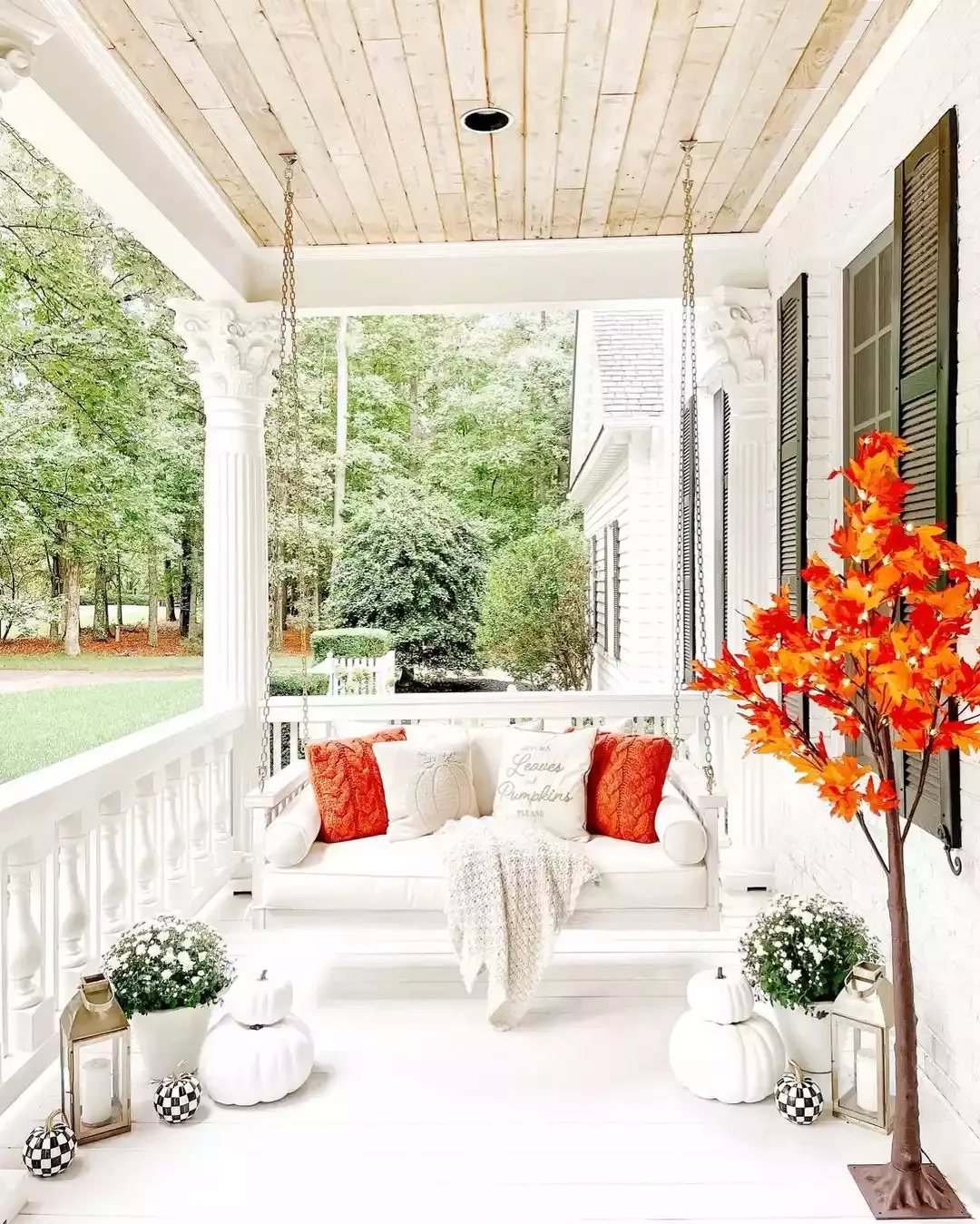 52 Autumn Front Porch Ideas That Will Transform Your Home's Entrance This Fall 3 Put Up a Faux Fall Tree