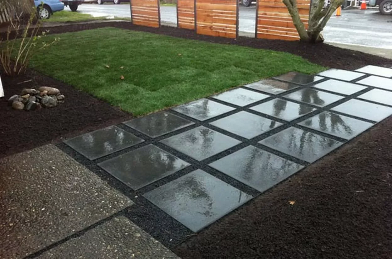10 Stunning Concrete Paver Walkway Ideas That Transform Your Home's Curb Appeal Rain-Glossy Concrete Front Square Walkway