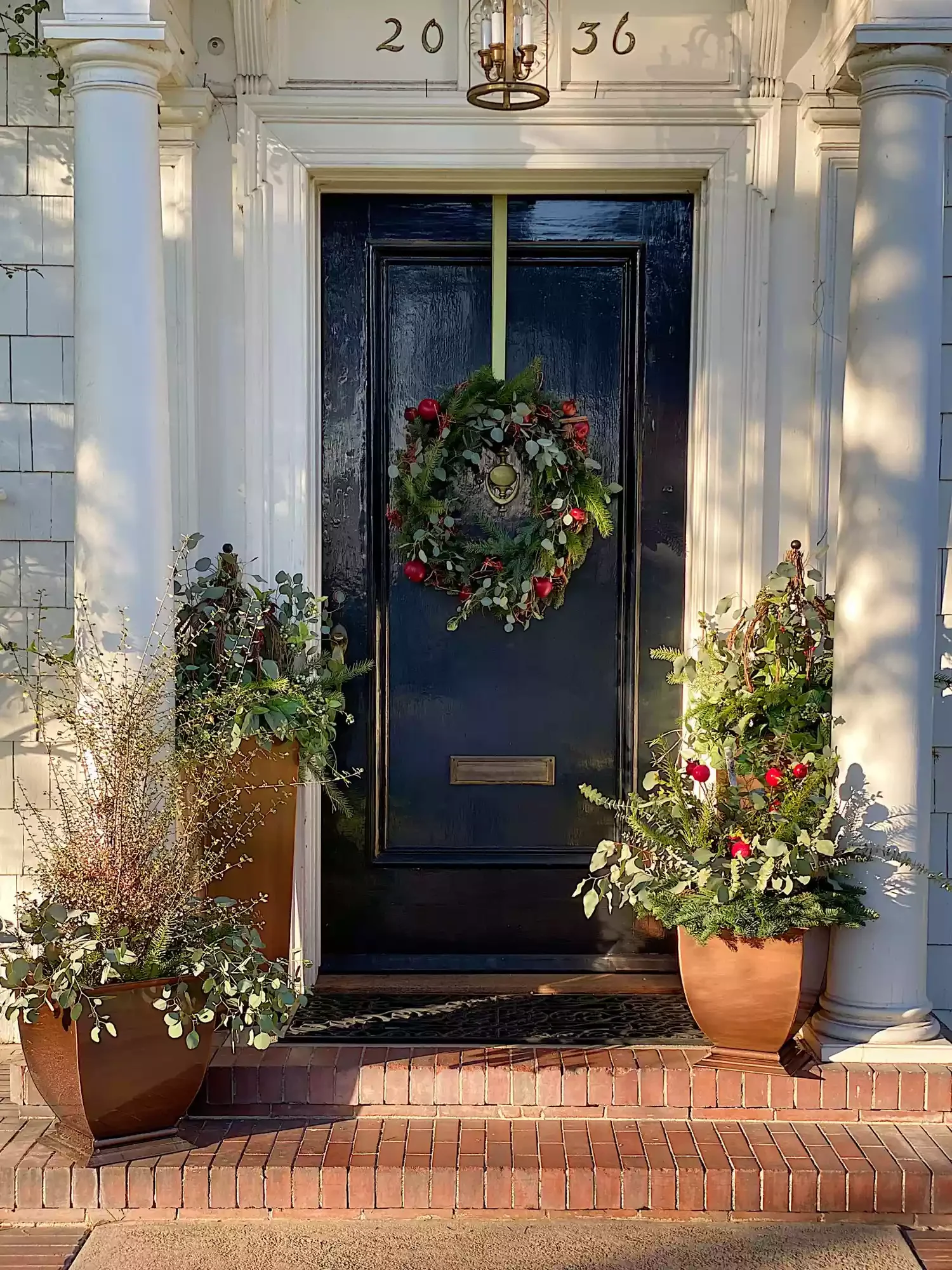 68 Christmas Front Porch Ideas That Make Your Home the Envy Real and Faux Greenery