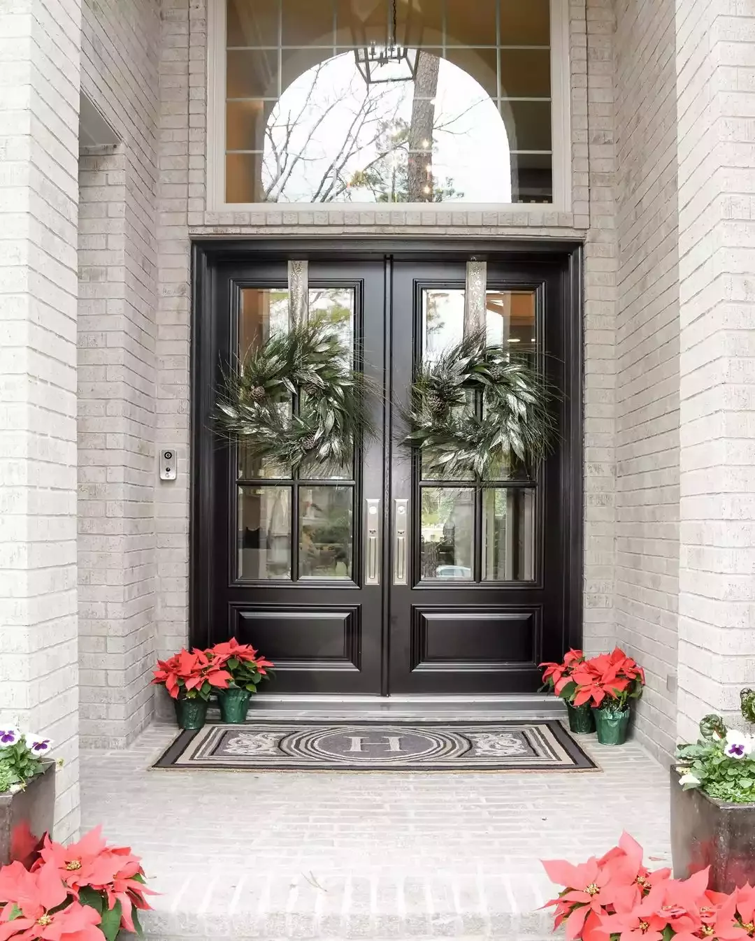 30 Christmas Door Decorating Ideas That Create Masterpieces Ribbon-Hung Door Wreaths