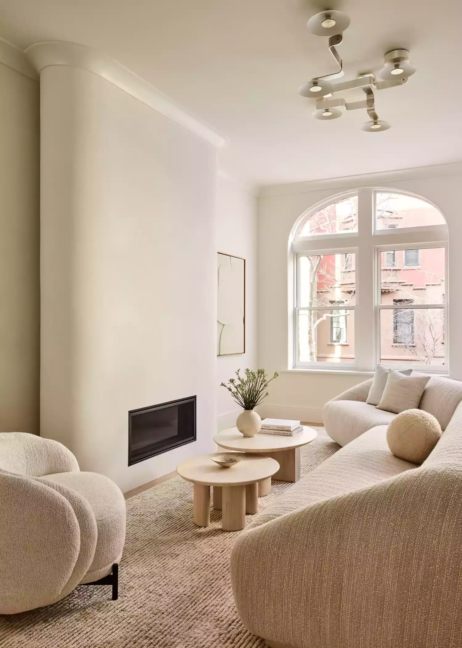 27 Stunning Linear Fireplace Ideas for Modern Homes That Combine Style and Easy Maintenance 12 Rounded Chimney Wall