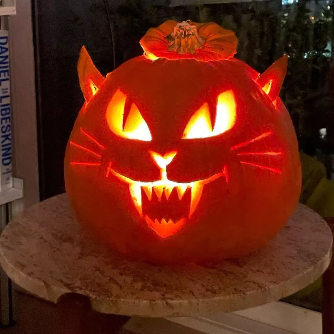 77 Creative Pumpkin Carving Ideas That'll Transform Your Fall Decorating Game 30 Scary Cat Pumpkin