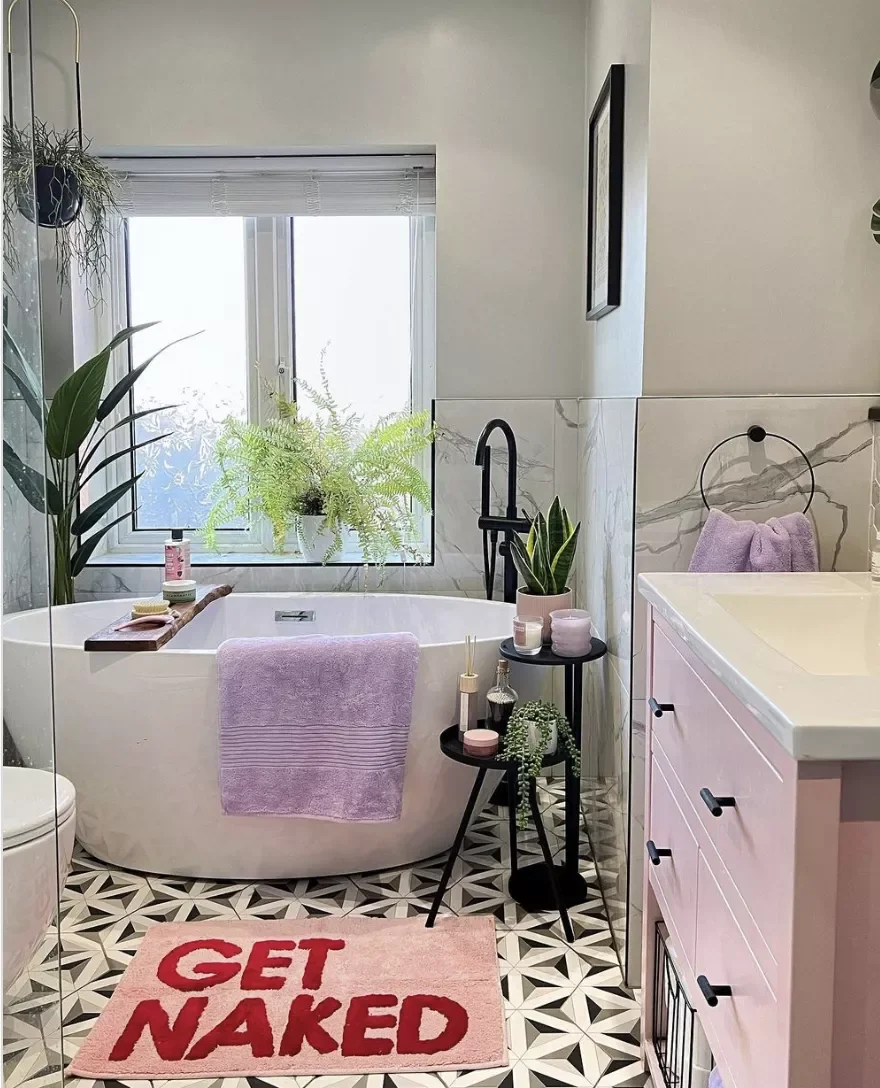 40 Stunning Pink Bathroom Ideas That Balance Playfulness with Elegance 11 Select a Cheeky Bathmat