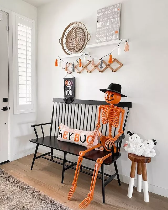 33 Stunning Fall Entryway Ideas That Transform Your Home for Autumn 7 Set Out a Skeleton