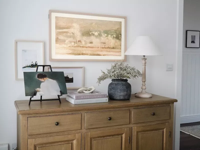 21 Beautiful Ways to Style Your TV Console Like a Pro 16 Set Out an Easel
