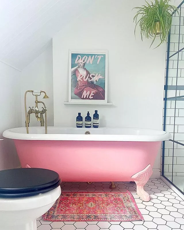 40 Stunning Pink Bathroom Ideas That Balance Playfulness with Elegance 25 Show Off Some Art By the Tub