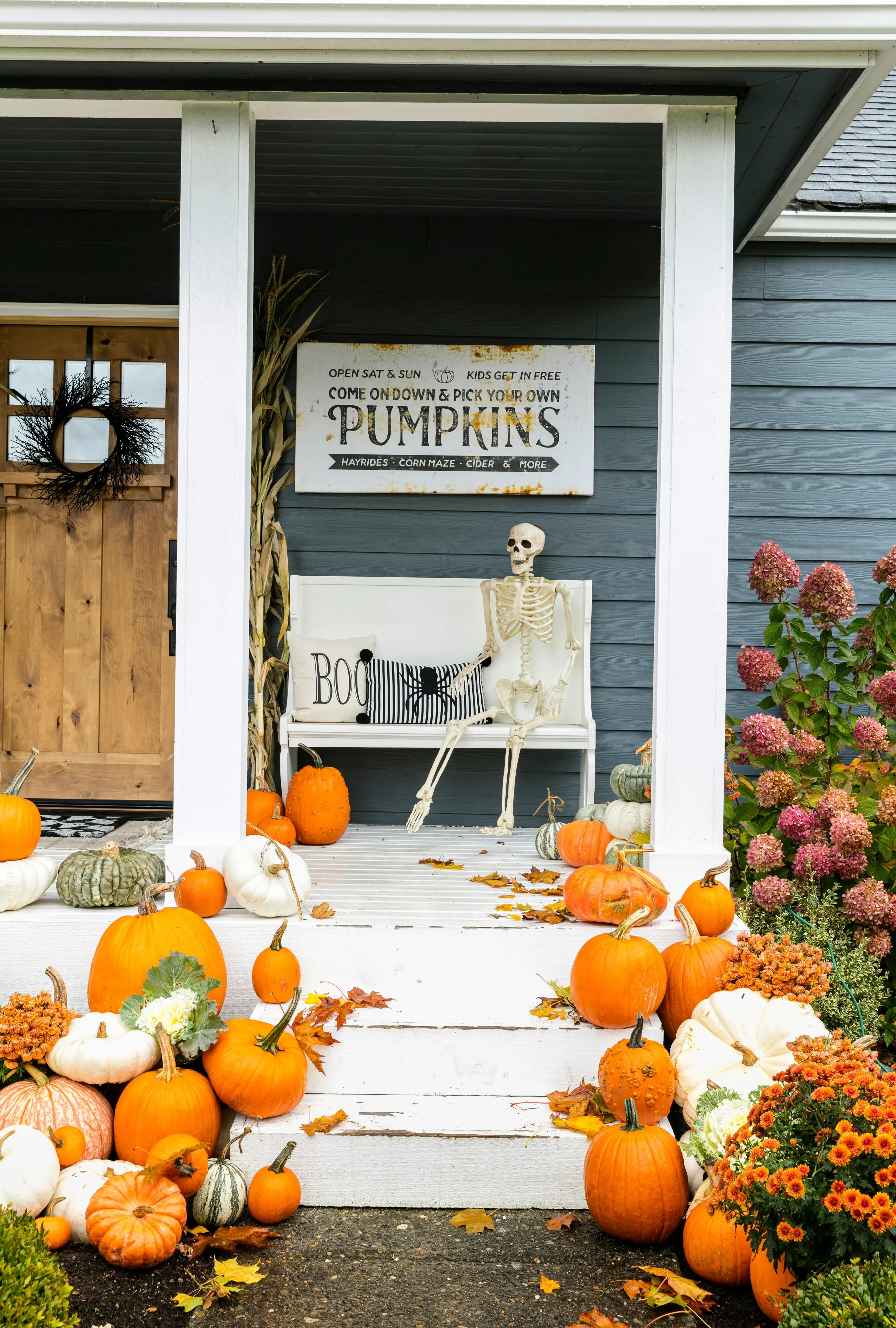 56 Creative DIY Halloween Decorations for Outdoor Spaces 42 Skeleton Front Porch Decor