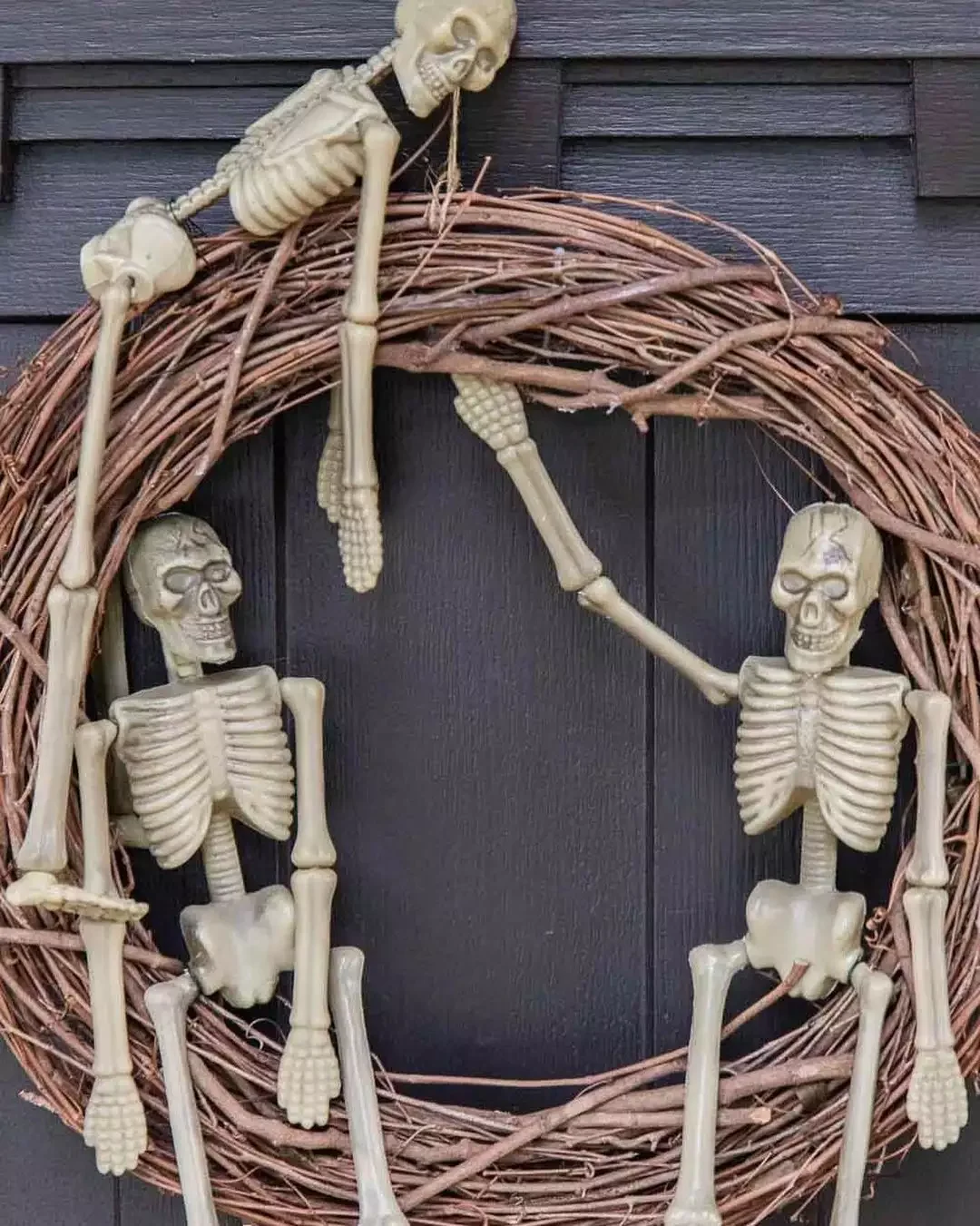 45 Spooktacular Halloween Wreath Ideas That Will Make Your Front Door the Neighborhood's Favorite Stop 1 Skeleton Halloween Wreath