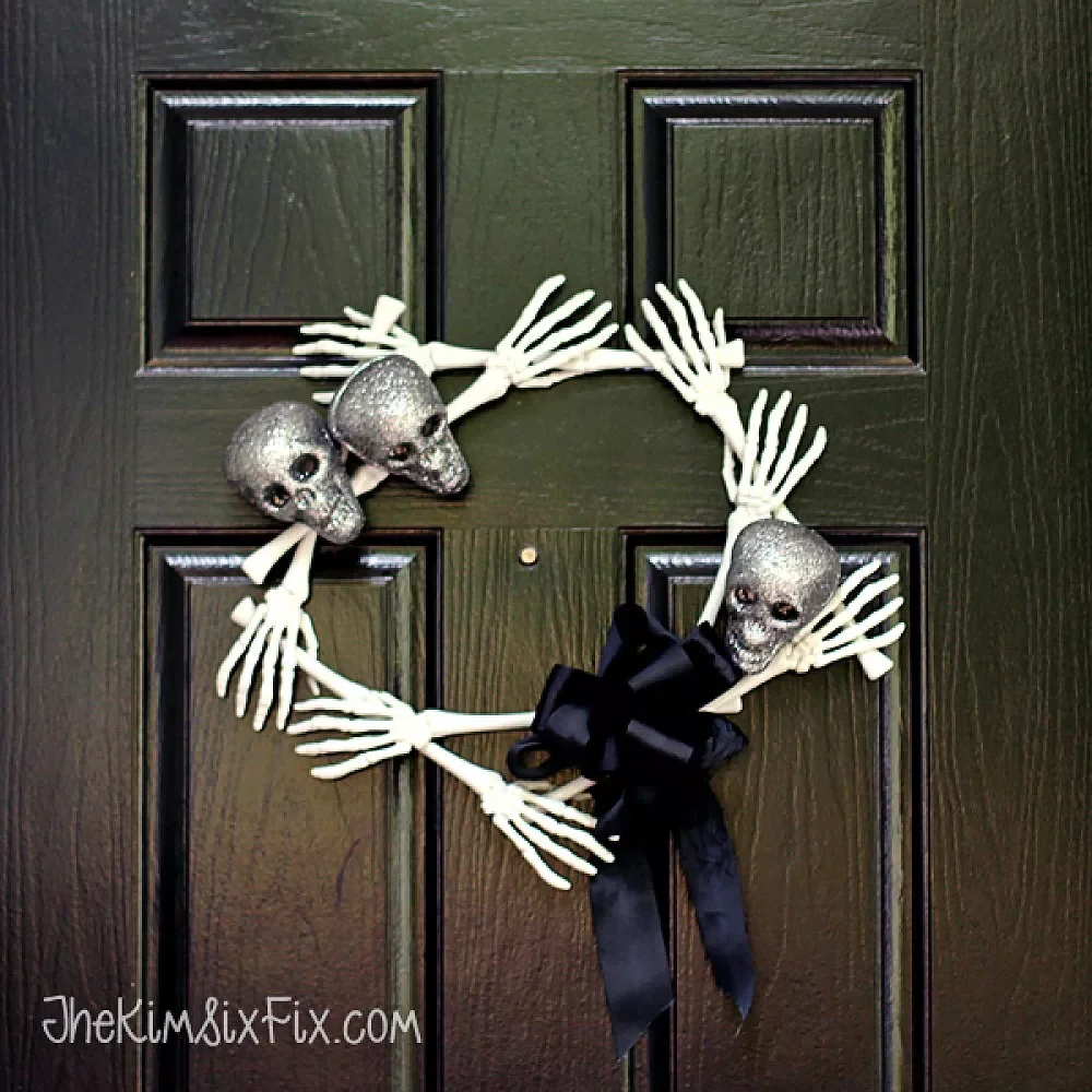 42 Quick Halloween Door Decorations You Can Create in Under an Hour 21 Skull and Bones Wreath