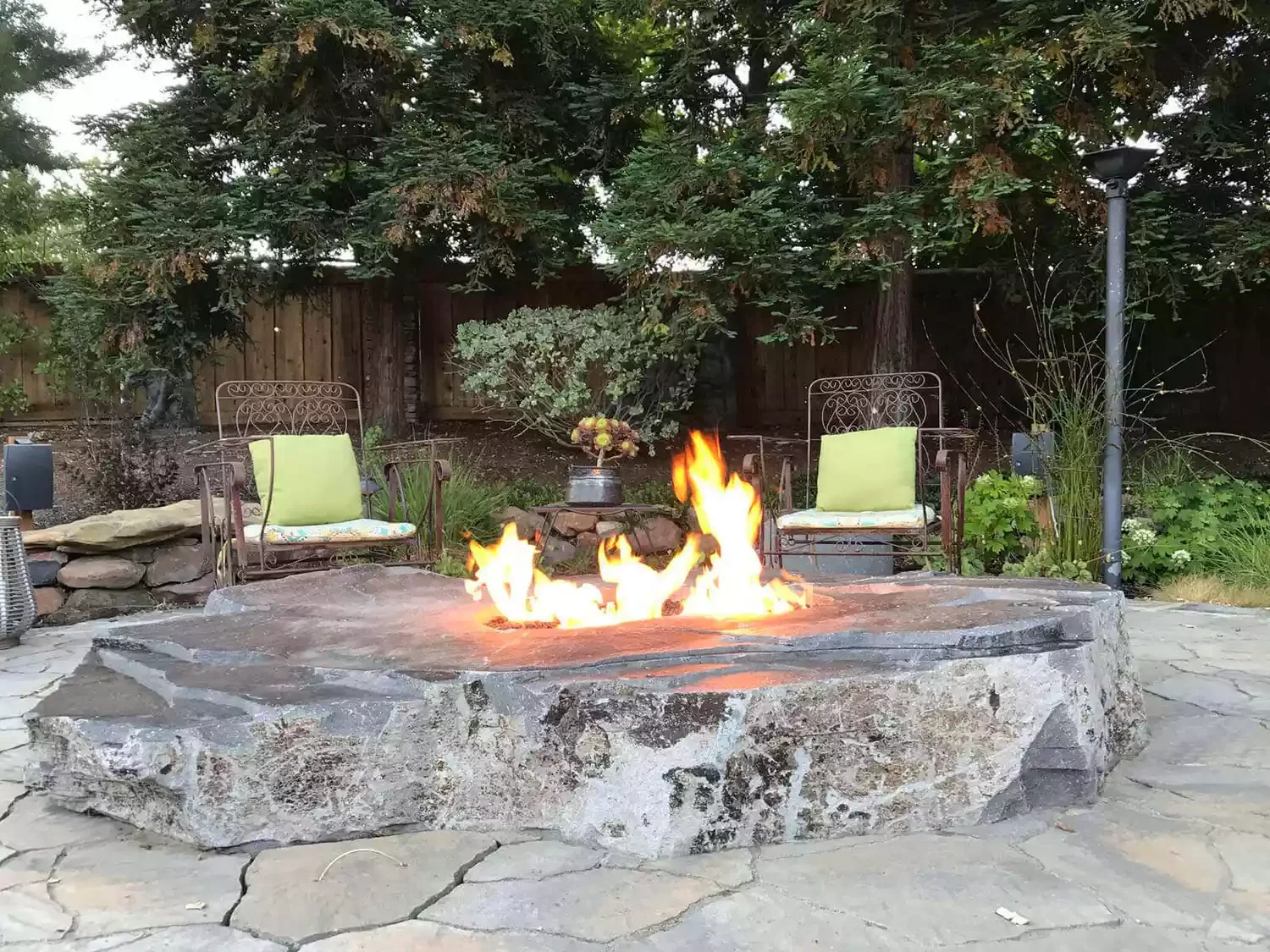 21 Beautiful Stone Fire Pit Designs That Will Transform Your Backyard 21 Sliced Boulder Fire Pit