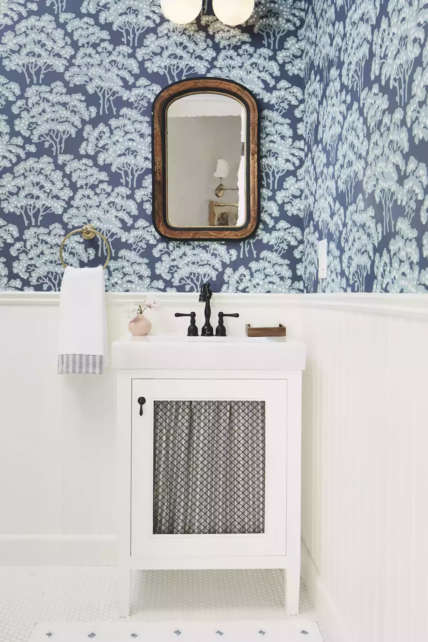 25 Compact Bathroom Vanity Ideas That Maximize Style and Storage 23 Small Vanity With a Decorative Door