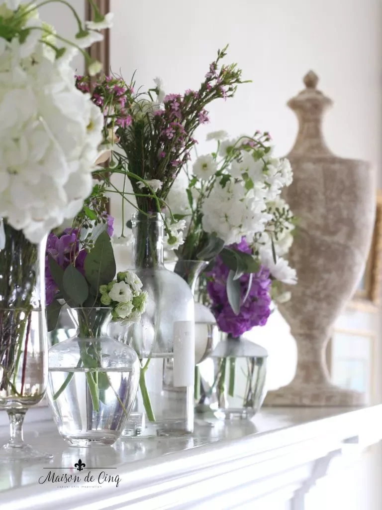 30 Beautiful Spring Mantel Ideas That Will Transform Your Living Space 18 Staggered Height Vases