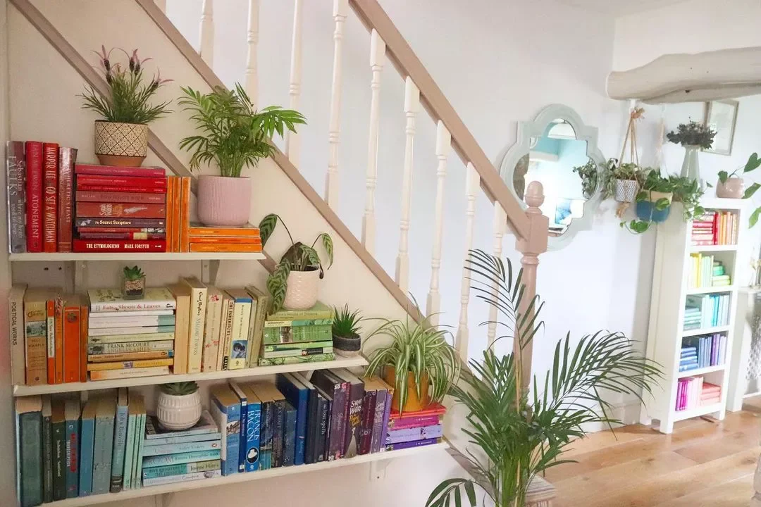 Creative Ways to Display Your Book Collection Throughout Your Home Stash Books in Rainbow Order