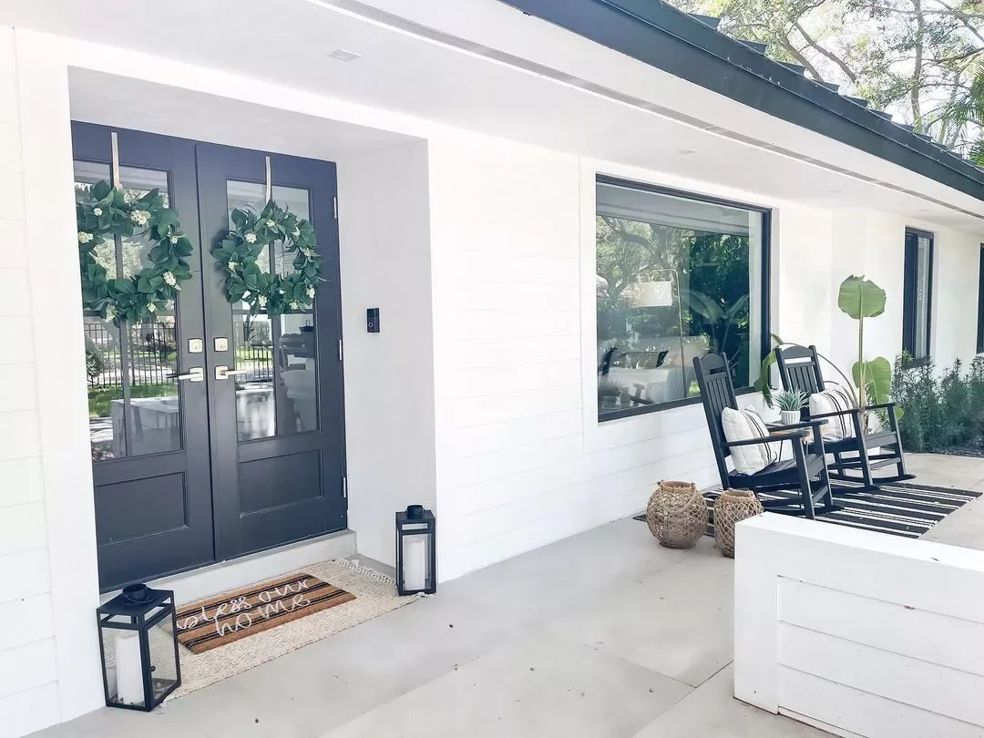 38 Charming Farmhouse Porch Ideas That Create the Perfect Welcome 18 Stick With Black and White