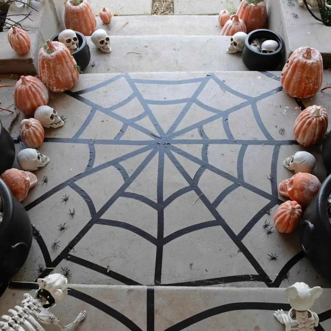 33 Spooktacular Halloween Front Porch Ideas That'll Make Your Home the Neighborhood's Must-See Destination 31 Stick on a Spider Web