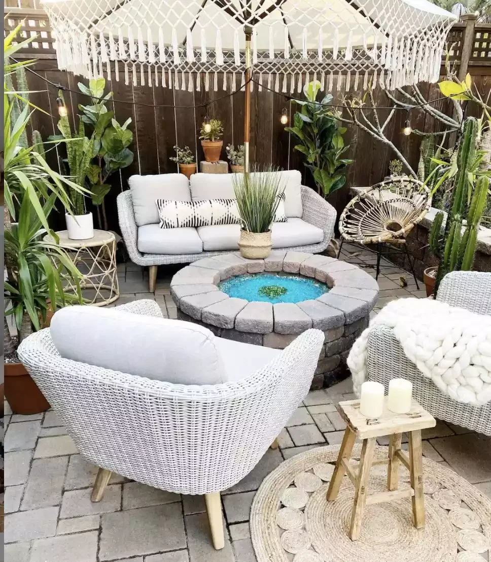 21 Beautiful Stone Fire Pit Designs That Will Transform Your Backyard 15 Stone Fire Pit Surrounded by Plant Oasis