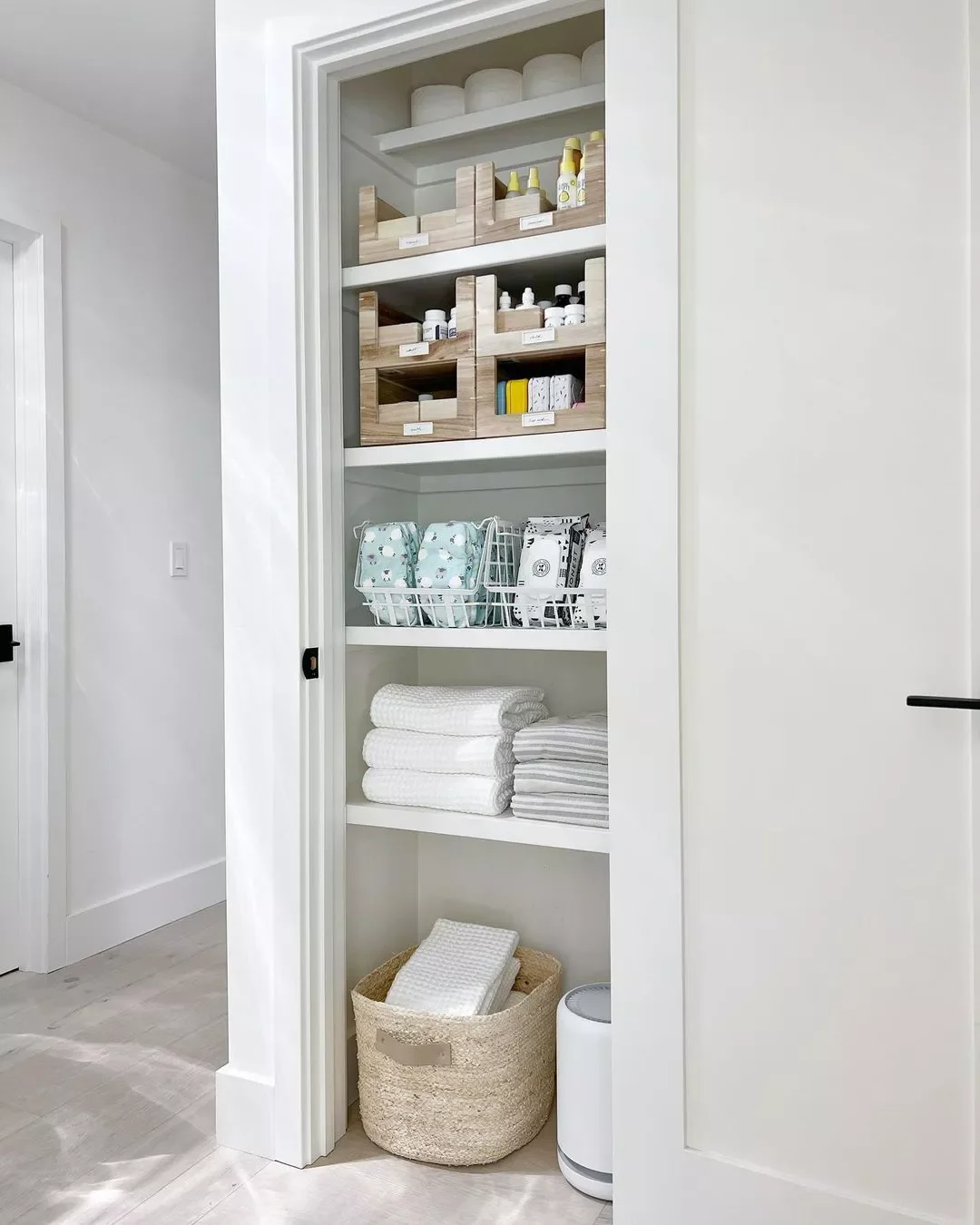 32 Clever and Stylish Ways to Store Your Towels Store Extra Towels in a Basket