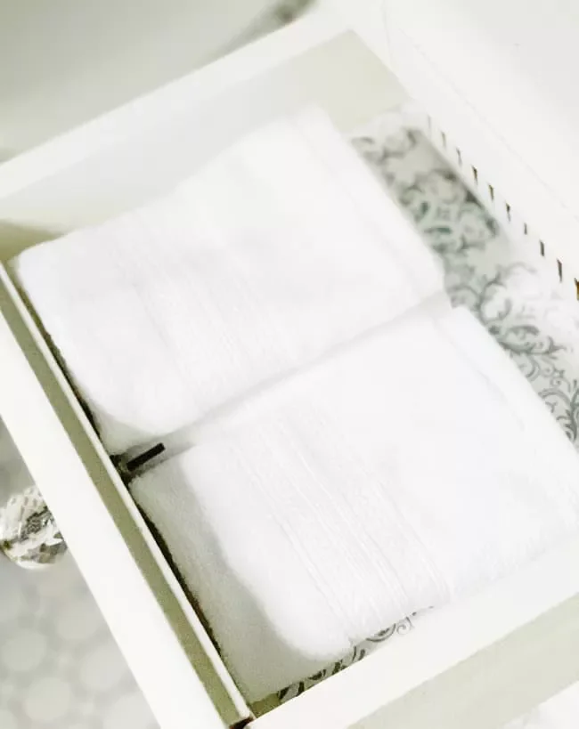 14 Smart Ways to Organize Your Bathroom Drawers for Maximum Storage Store Spare Washcloths
