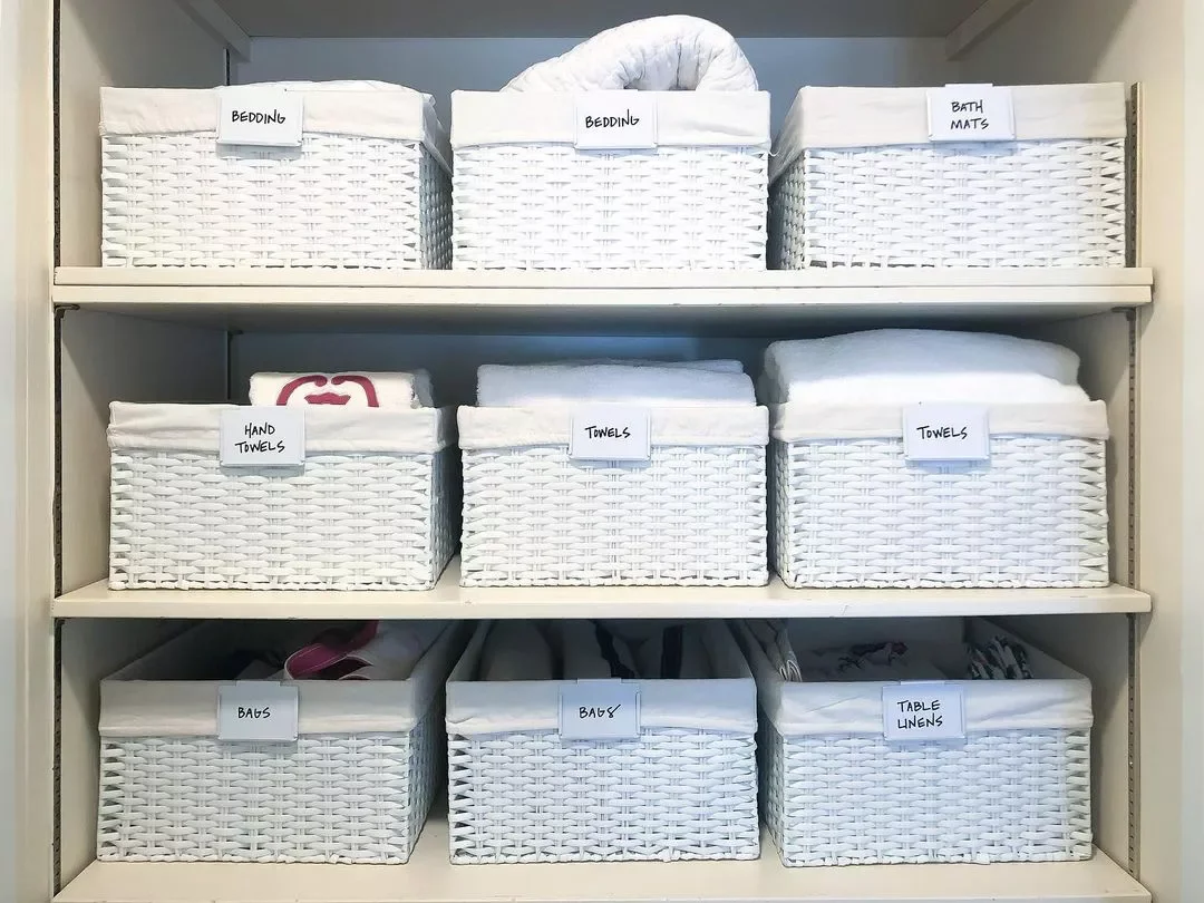 32 Clever and Stylish Ways to Store Your Towels Store Towels in Labeled Baskets