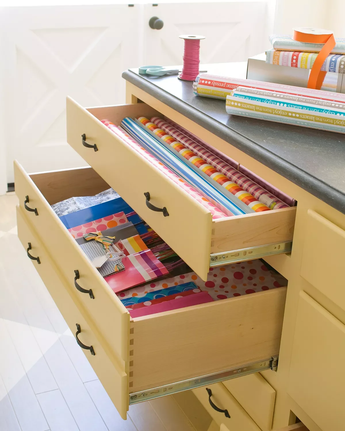 18 Creative Gift Wrap Storage Solutions That Banish Holiday Clutter Store Wrapping Paper Rolls in Drawers