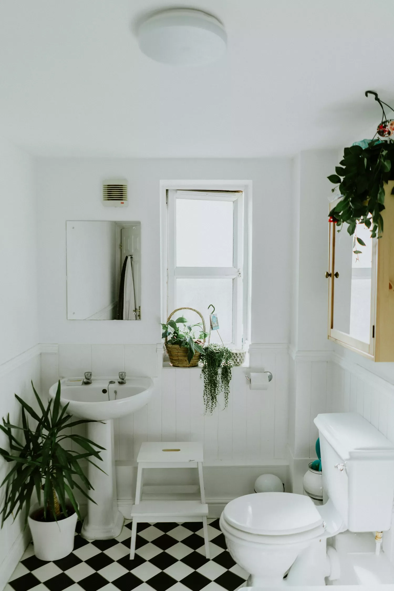 17 Brilliant Above-Toilet Storage Solutions That'll Transform Your Bathroom Style A Glass-Door Cabinet