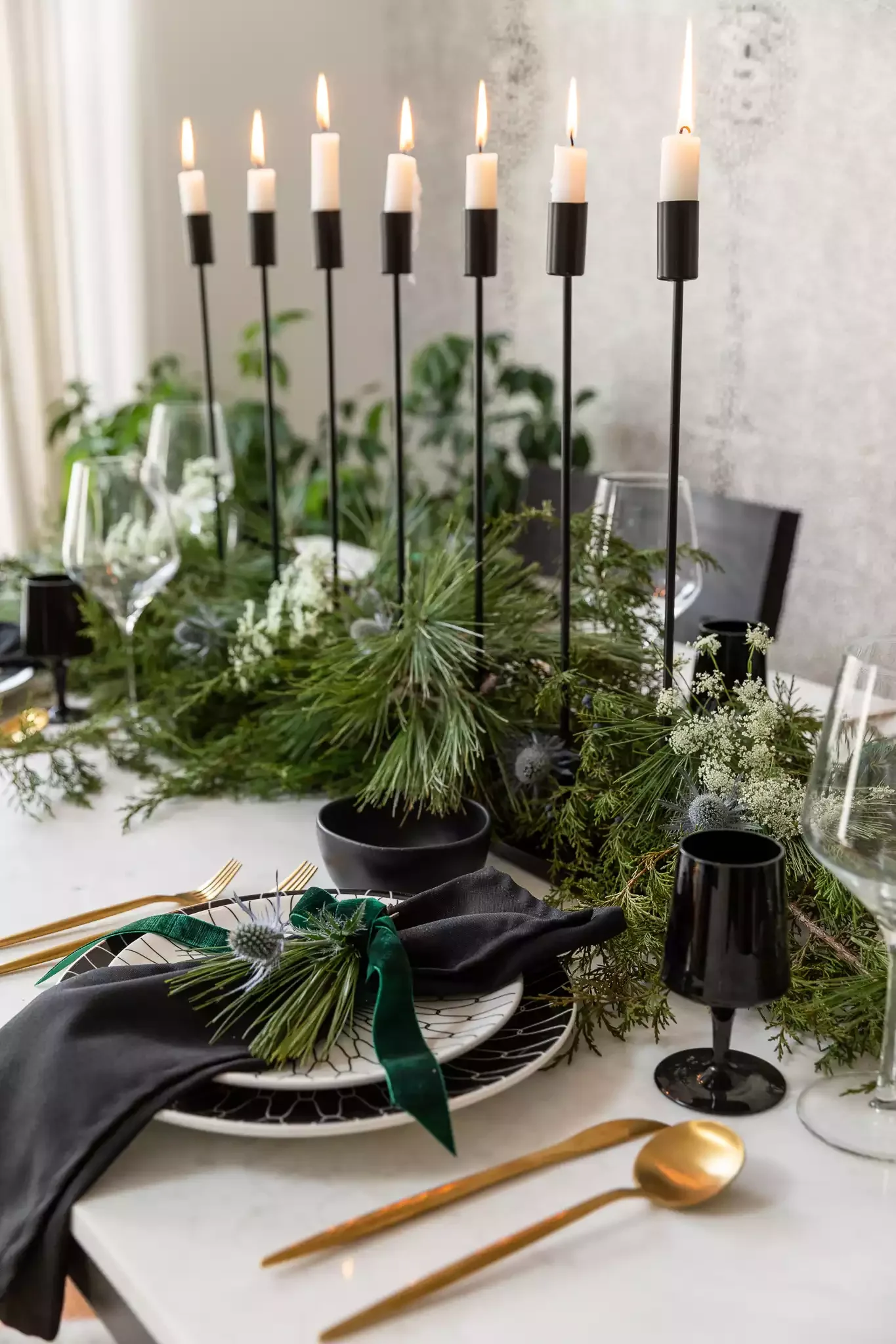 40 Stunning Christmas Table Decor Ideas That Will Make Your Holiday Gatherings Unforgettable 21 Tall Candles and Greenery